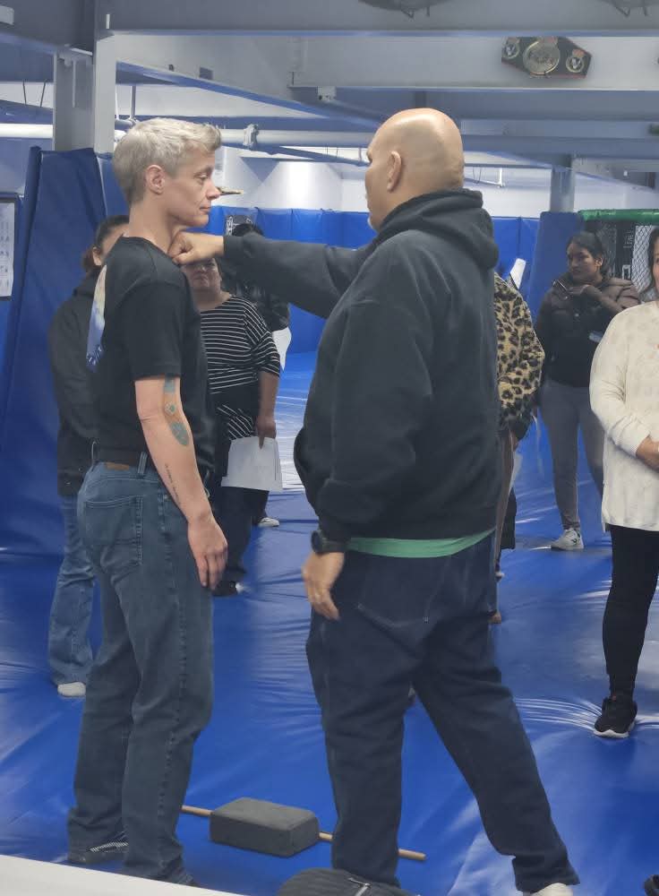 Leonardo Lechuga demonstrating a defense against a throat grab