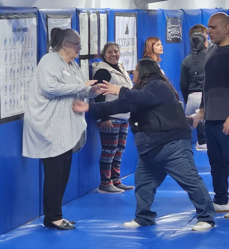 Participants practicing wrist-grab escapes together